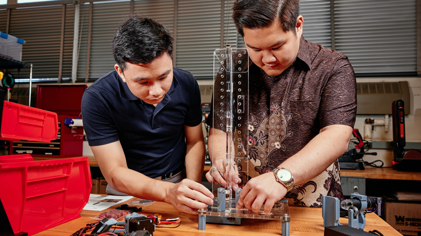 Young engineers working on a project.