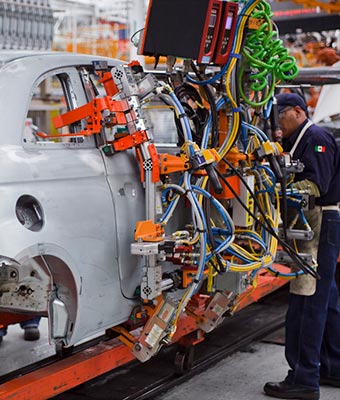 Robots work alongside humans at Chrysler Group's Toluca Assembly Plant in Mexico.
